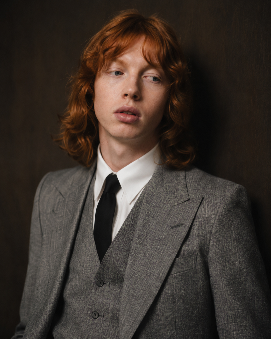 Close portrait of a red-haired model in tailoring
